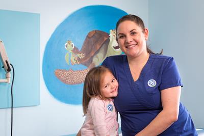 Pediatric nurse and young female patient